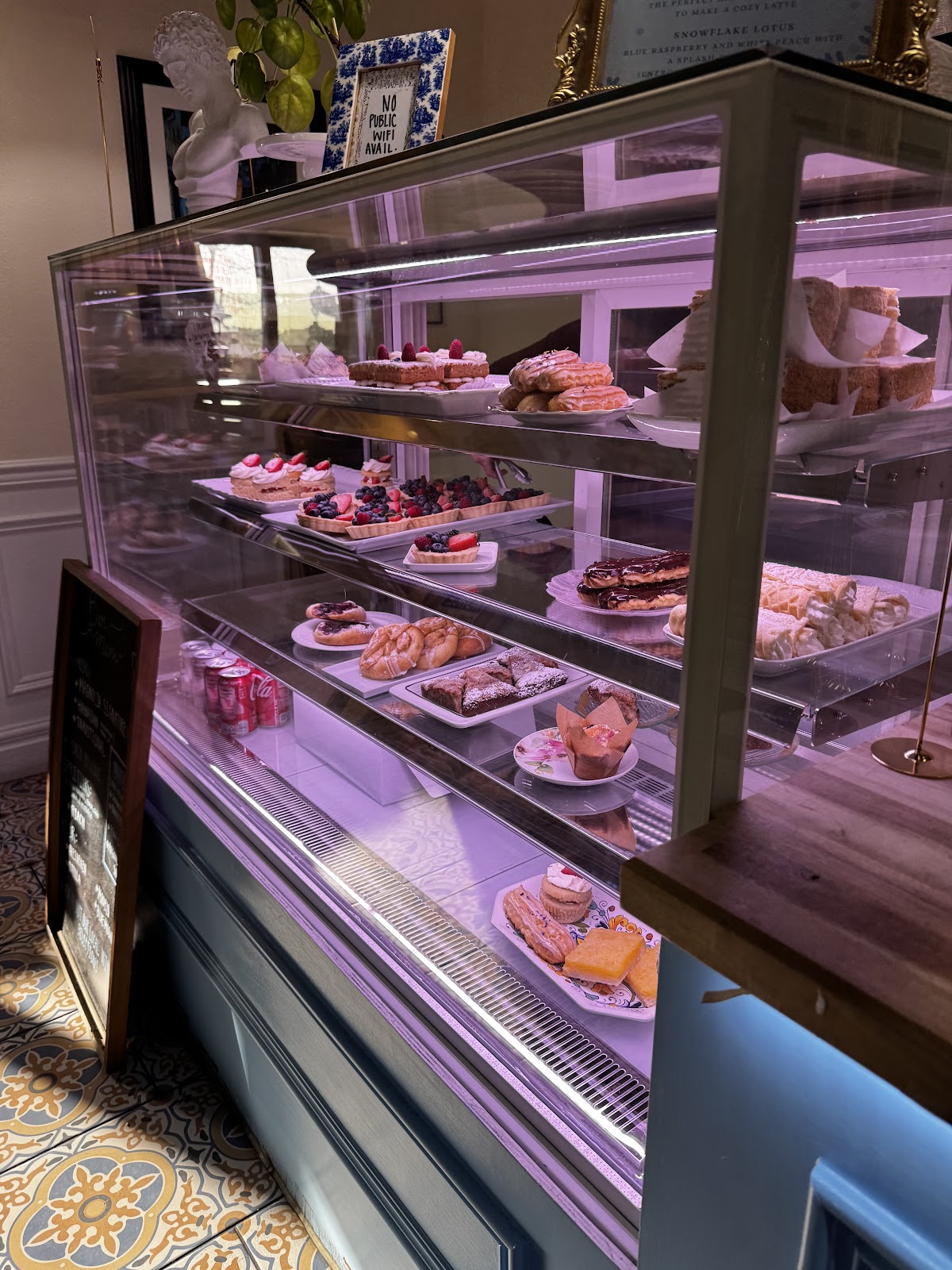 The pastry display case at Café Magnolia, full of fresh European cakes and tarts